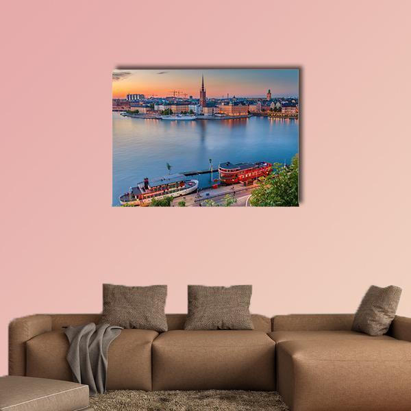 Stockholm Skyline at Dusk Canvas Wall Art in orange and blue, single panel hung on a wall