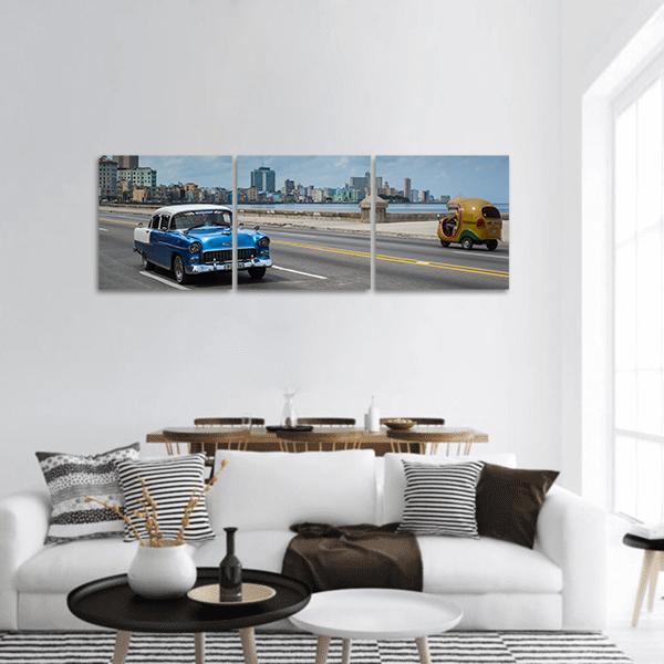 Classic American Car on Havana Malecón Panoramic Canvas Wall Art in gray and blue, hung on a wall