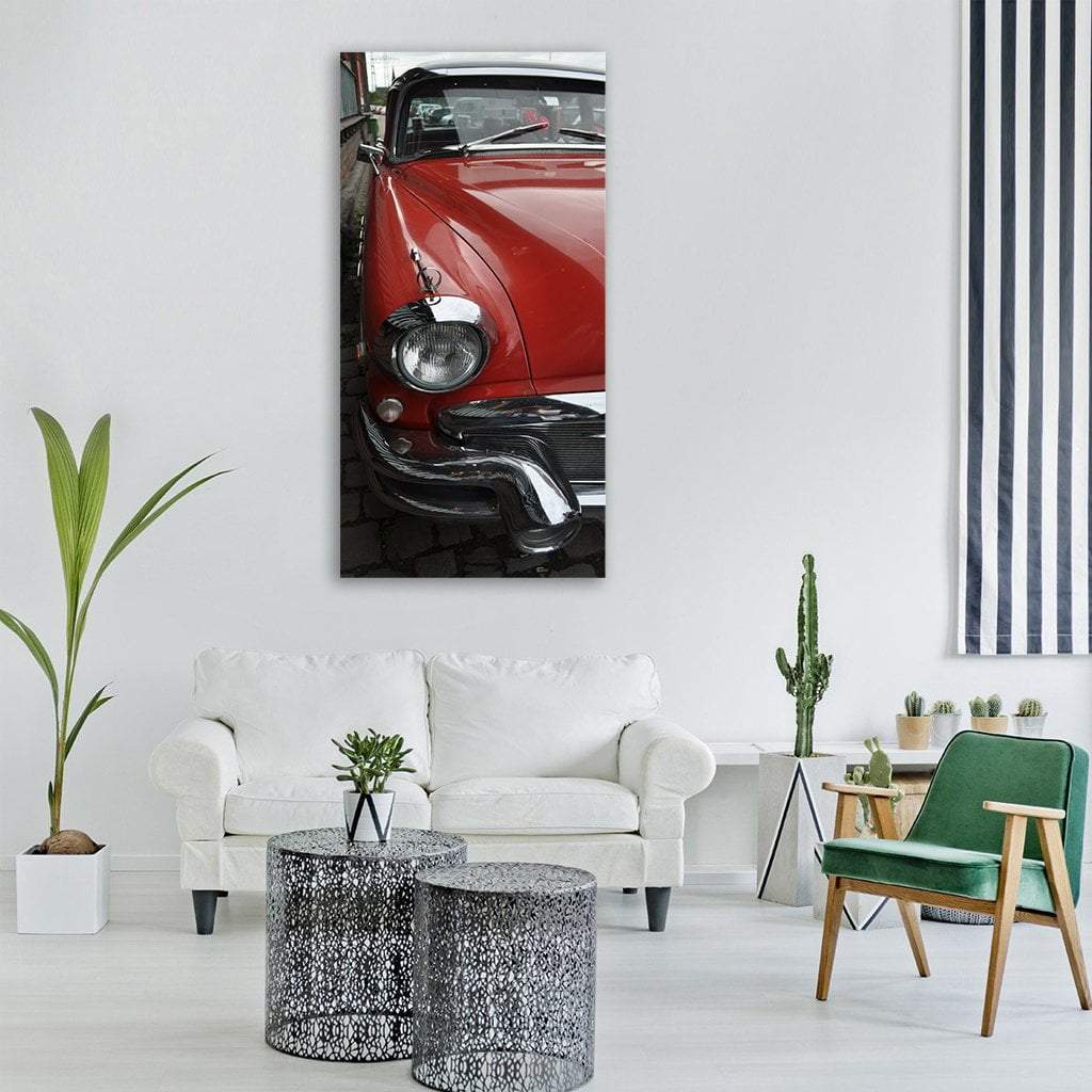 Red Vintage Car Close-up Vertical Canvas Wall Art in black, silver and red, single vertical panel hung on a wall