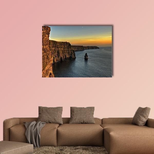 Cliffs of Moher at Sunset with Sea Stack Canvas Wall Art in brown, orange and blue, single panel hung on a wall