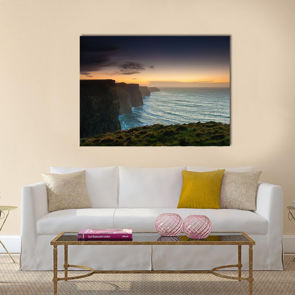 Evening at Cliffs of Moher Canvas Wall Art in black, orange and blue, single panel hung on a wall