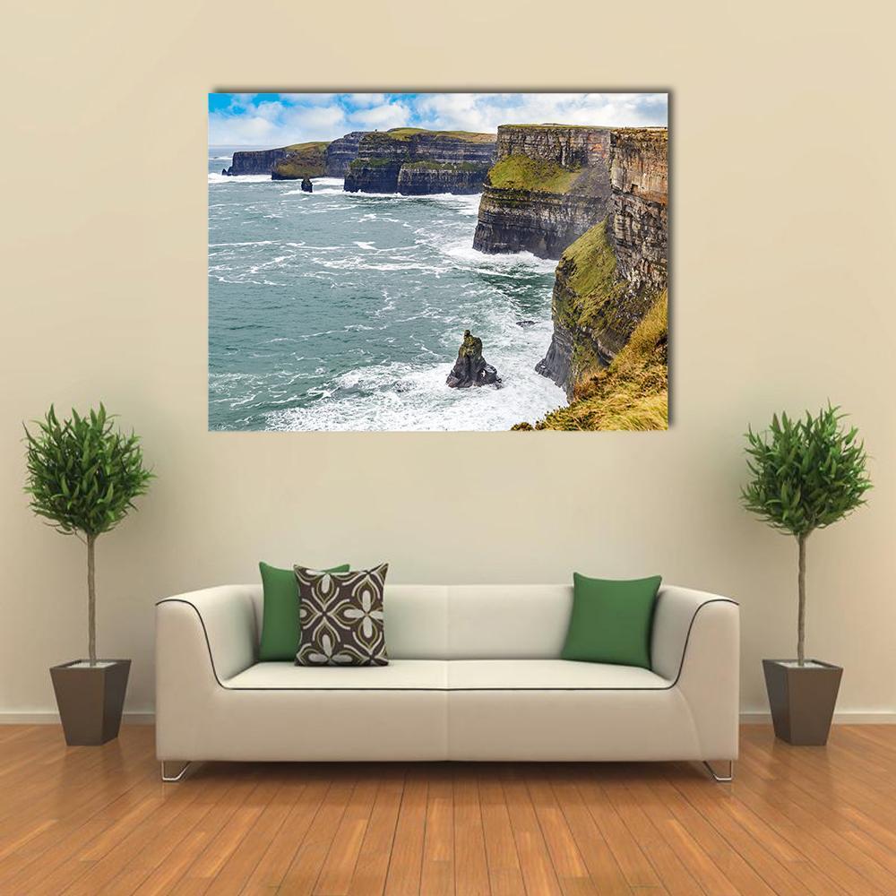 Cliffs of Moher Stormy Coastline Canvas Wall Art in gray, green and blue, single panel hung on a wall