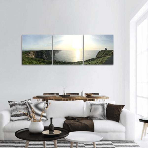 Moher Cliffs Sunrise Seascape Panoramic Canvas Wall Art in yellow, green and blue, hung on a wall