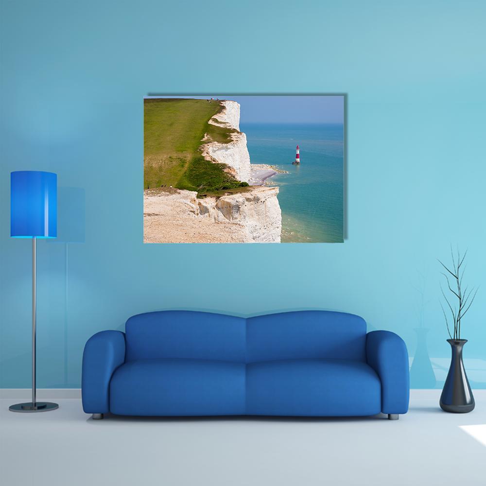 Red and White Striped Lighthouse on Chalk Cliffs Canvas Wall Art in white, green and blue, single panel hung on a wall
