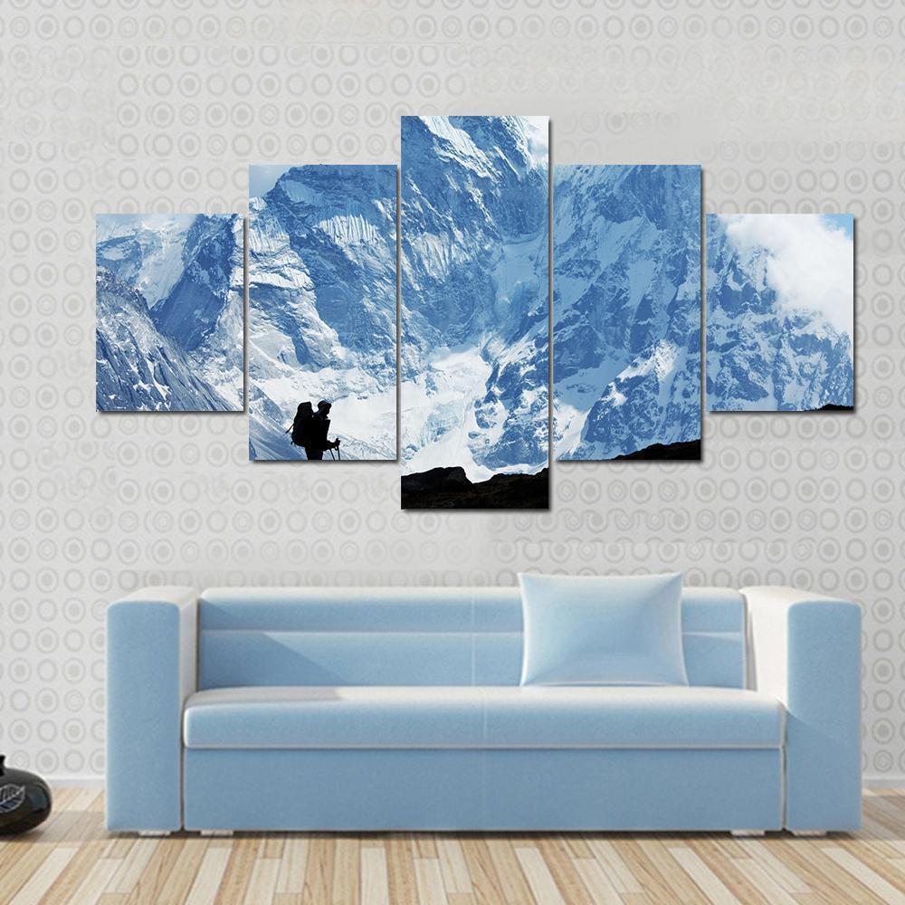 Climber on Himalaya Canvas Wall Art in black, white and blue, 5 panel Star layout hung on a wall
