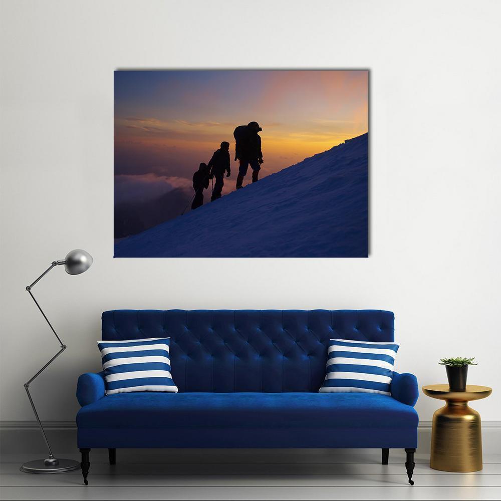 Climbers on Everest at Dusk Canvas Wall Art in black, orange and blue, single panel hung on a wall