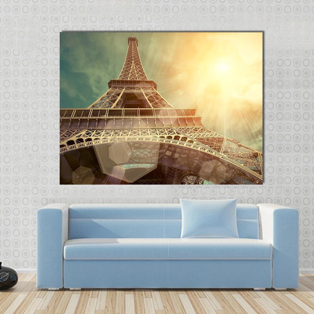 Close Up Eiffel Tower Canvas Wall Art in brown, gold and yellow, 3 panel horizontal set hung on a wall
