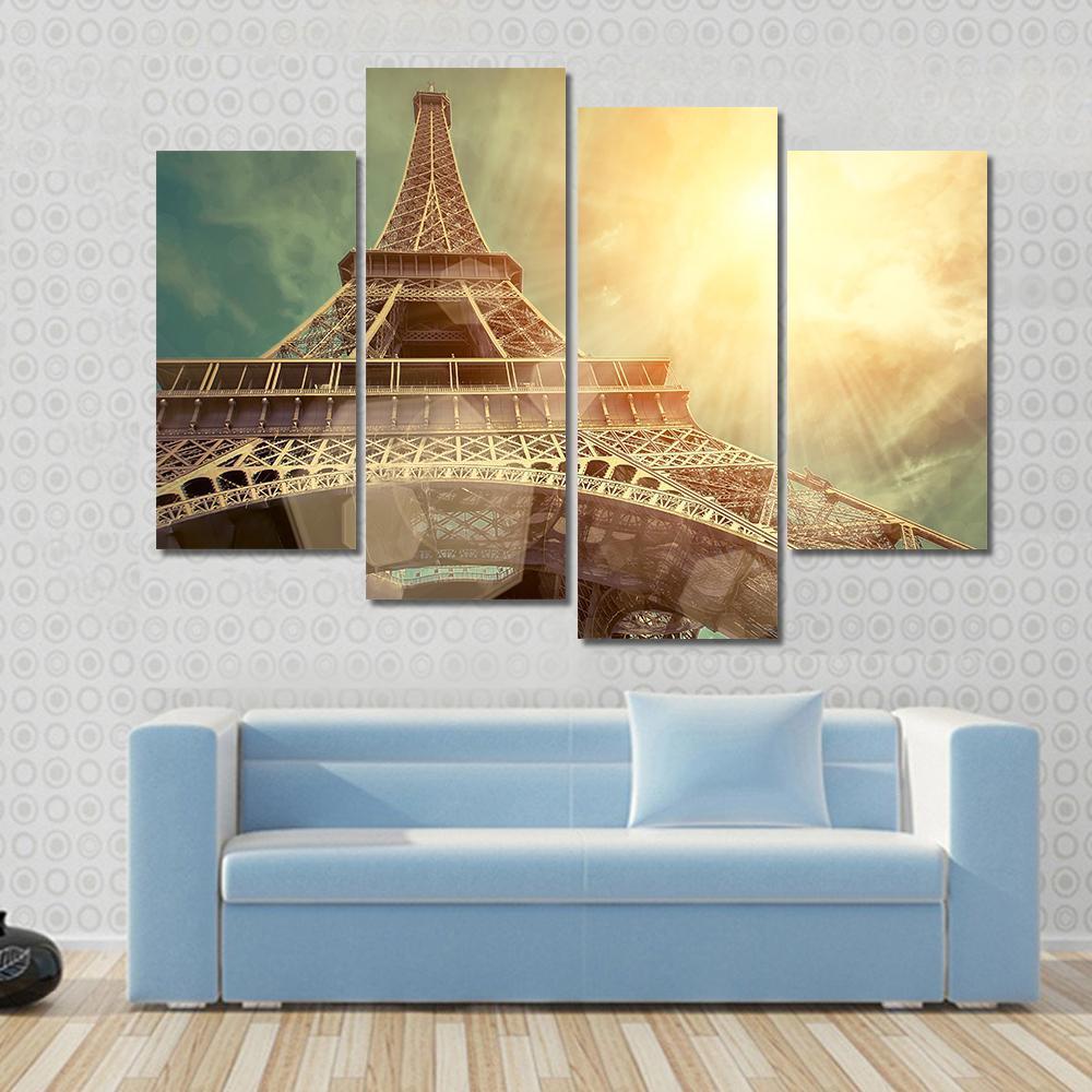 Close Up Eiffel Tower Canvas Wall Art in brown, gold and yellow, 3 panel horizontal set hung on a wall