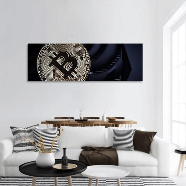 Bitcoin Coin Close-up with Circuitry Panoramic Canvas Wall Art in black and gold, hung on a wall