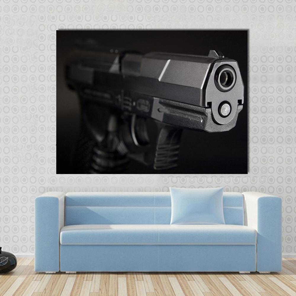Close Up of Pistol Canvas Wall Art in black and gray, single panel hung on a wall