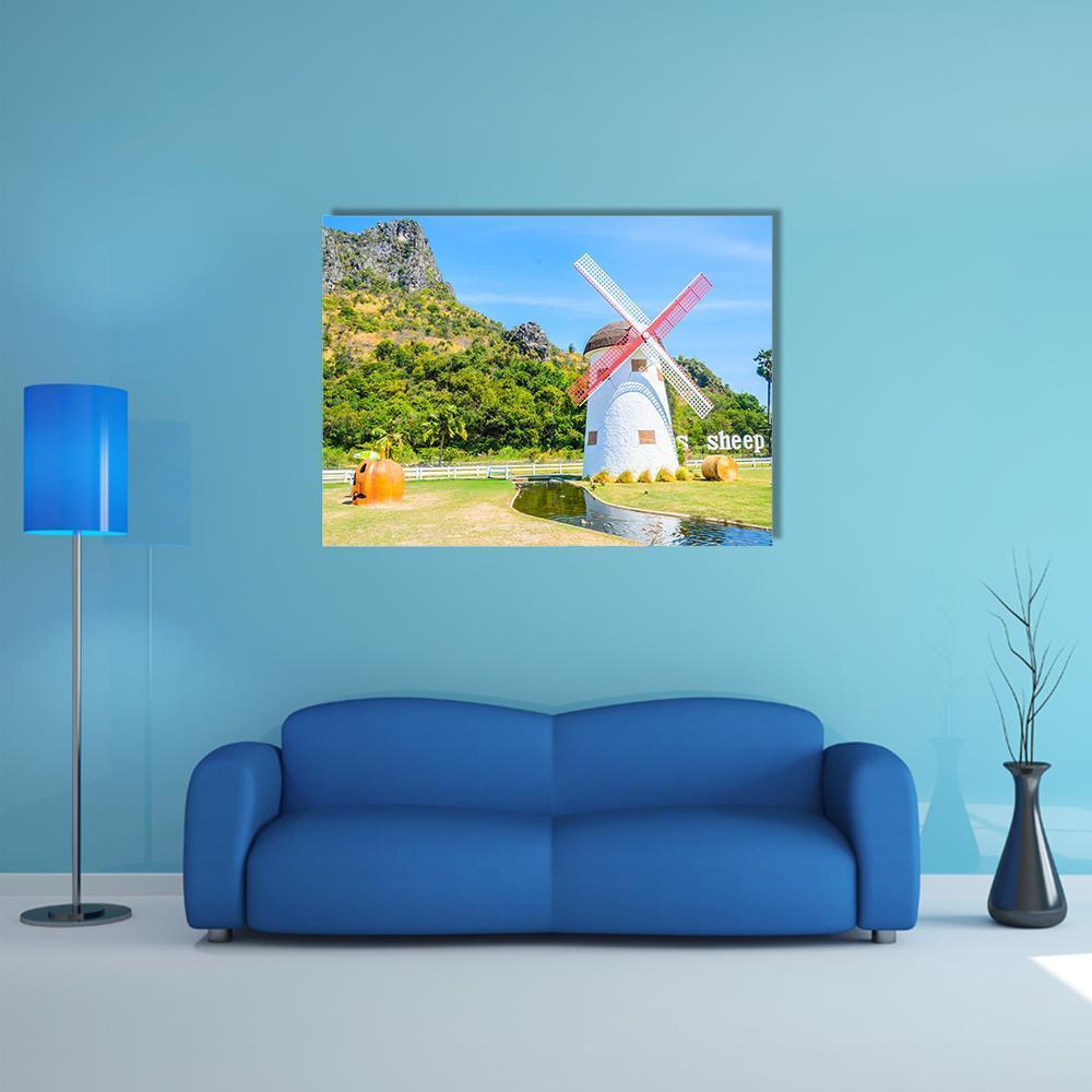 Close-up Windmill with Sheep and Pond Canvas Wall Art in white, green and blue, single panel hung on a wall