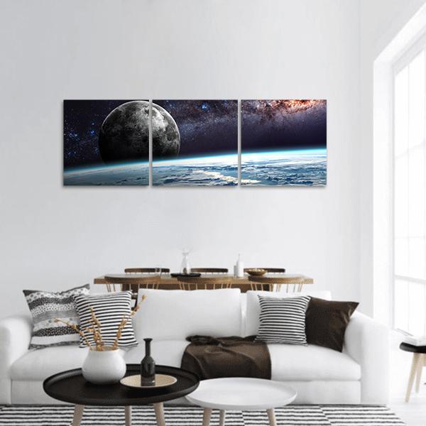 Earth Horizon with Moon and Milky Way Panoramic Canvas Wall Art in black, white and blue, hung on a wall