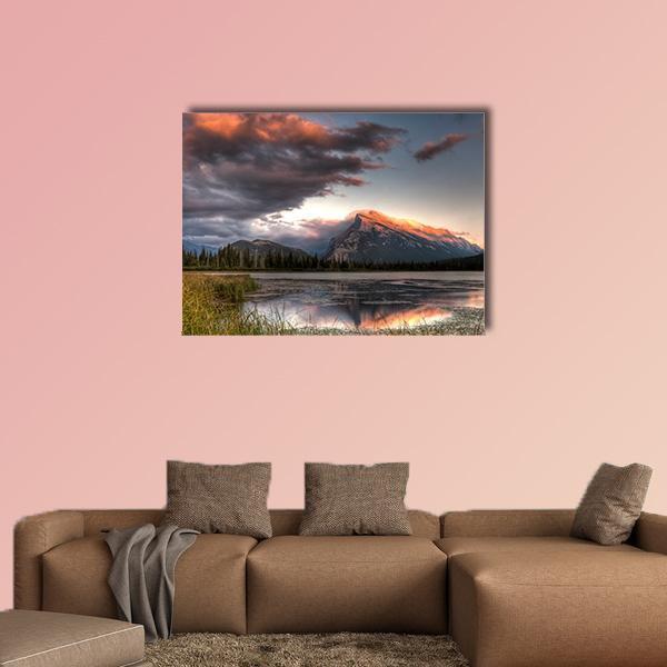 Clouds Over Mountain Lake at Sunset Canvas Wall Art in gray, orange and blue, single panel hung on a wall
