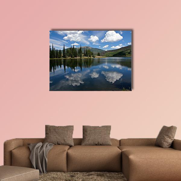 Clouds on Pearl Lake Canvas Wall Art in white, green and blue, single panel hung on a wall