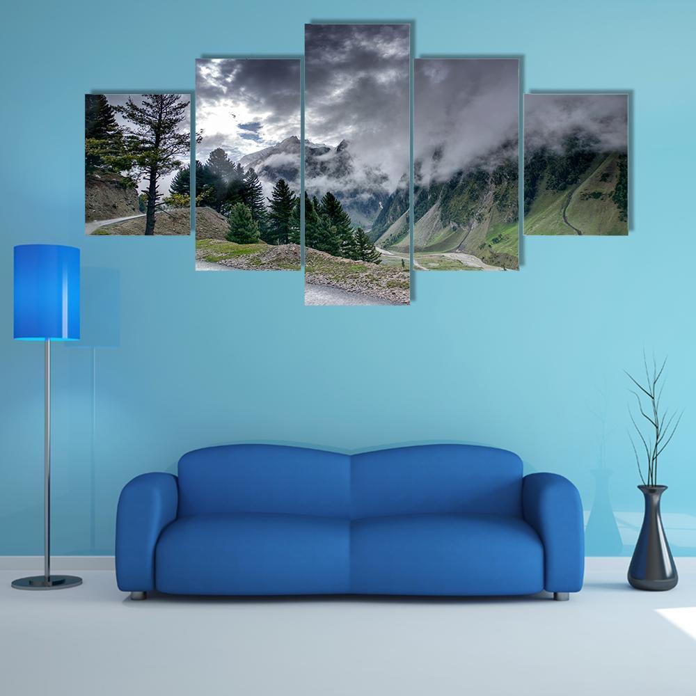 Winding Mountain Road Beneath Storm Clouds Canvas Wall Art in black, gray and green, 5 panel Star layout hung on a wall