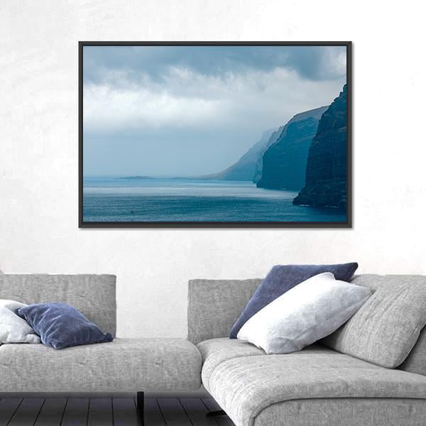 Cloudy Cliffs of Los Gigantes Canvas Wall Art in gray and blue, framed canvas, product view on a white background