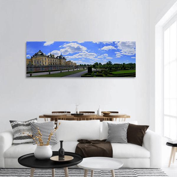 Drottningholm Castle and Formal Gardens Panoramic Canvas Wall Art in white, green and blue, single panel hung on a wall