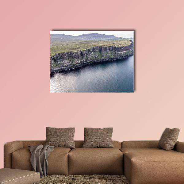 Kilt Rock Cliffs Canvas Wall Art in gray, green and blue, single panel hung on a wall