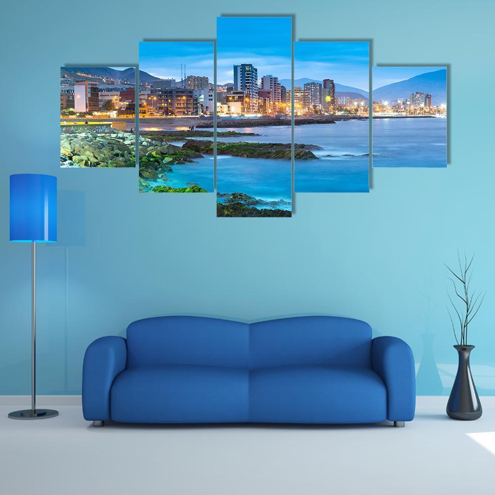 Antofagasta Coastline at Dusk Canvas Wall Art in black, yellow and blue, 5 panel Star layout hung on a wall