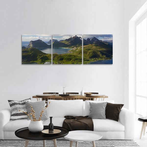 Winding Coastal Road and Snow-capped Peaks Panoramic Canvas Wall Art in gray, green and blue, hung on a wall