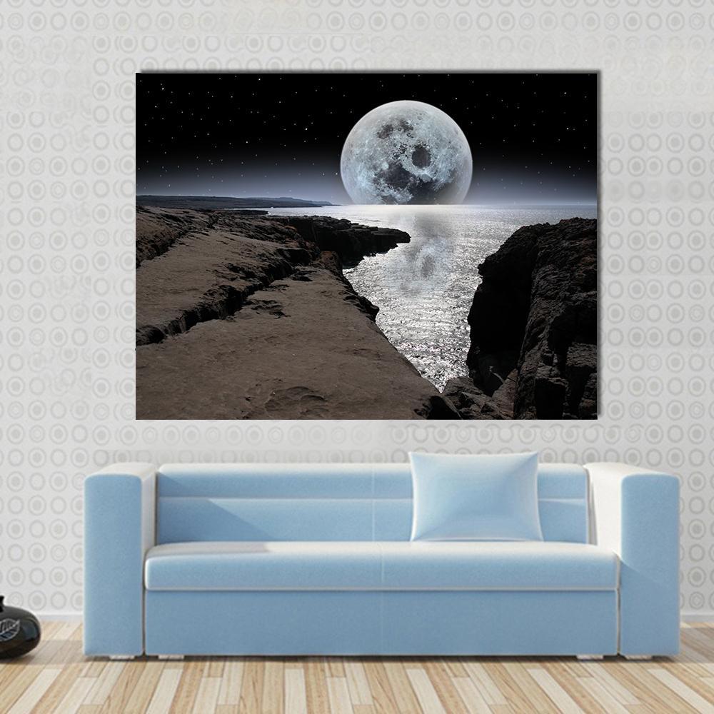Bright Moon Over Rocky Coastline Canvas Wall Art in black, gray and silver, single panel hung on a wall