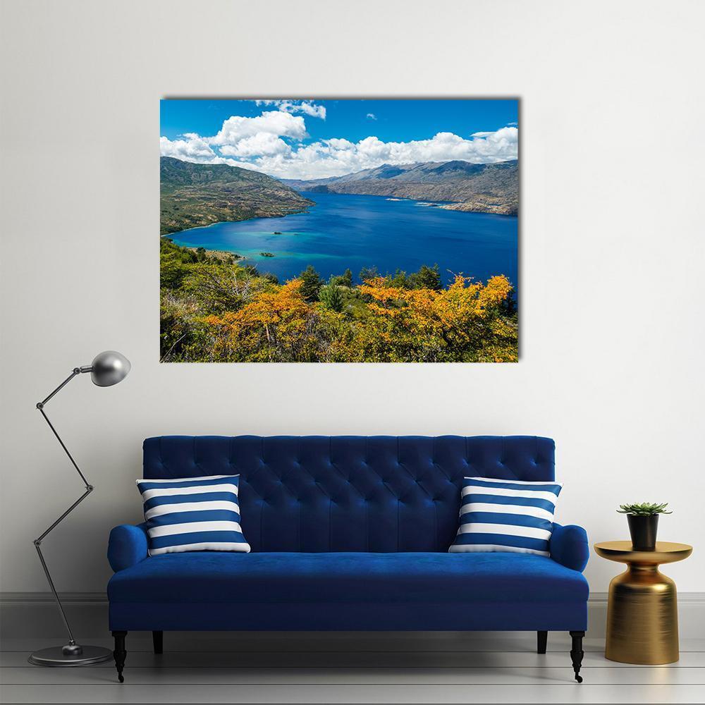 Cochrane Lake Chile Landscape Canvas Wall Art in yellow, green and blue, single panel hung on a wall