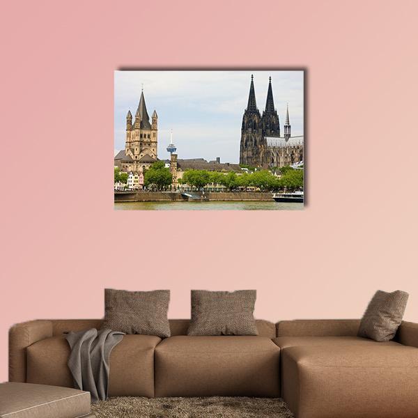 Cologne Cathedral and the Rhine River Canvas Wall Art in gray, green and blue, single panel hung on a wall
