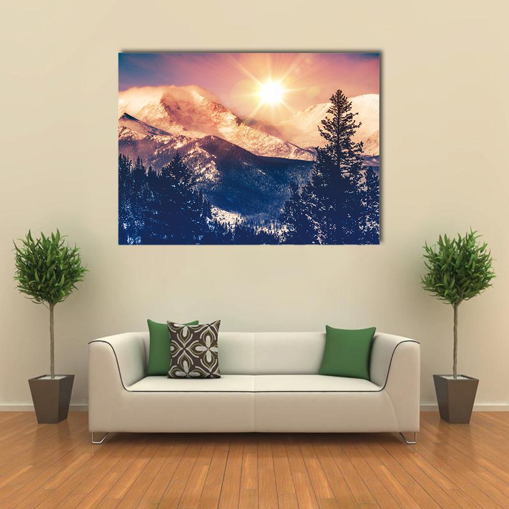 Colorado Mountains at Sunrise Canvas Wall Art in orange, blue and pink, single panel hung on a wall