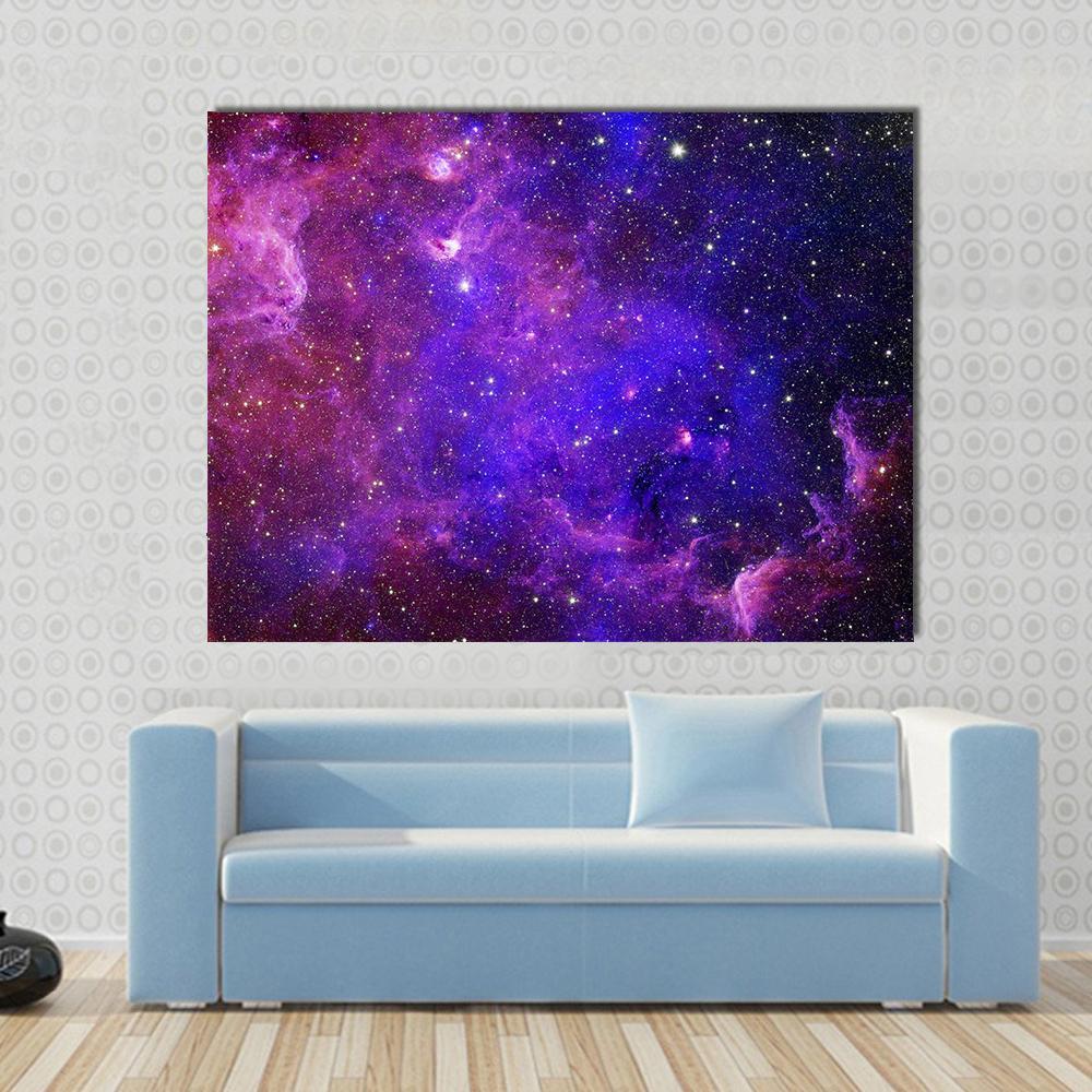 Colorful Carina Nebula Canvas Wall Art in blue, purple and pink, single panel hung on a wall
