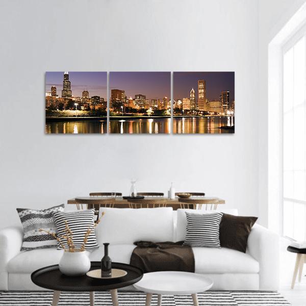 Chicago Skyline Over Lake Michigan Panoramic Canvas Wall Art in black, gold and blue, hung on a wall