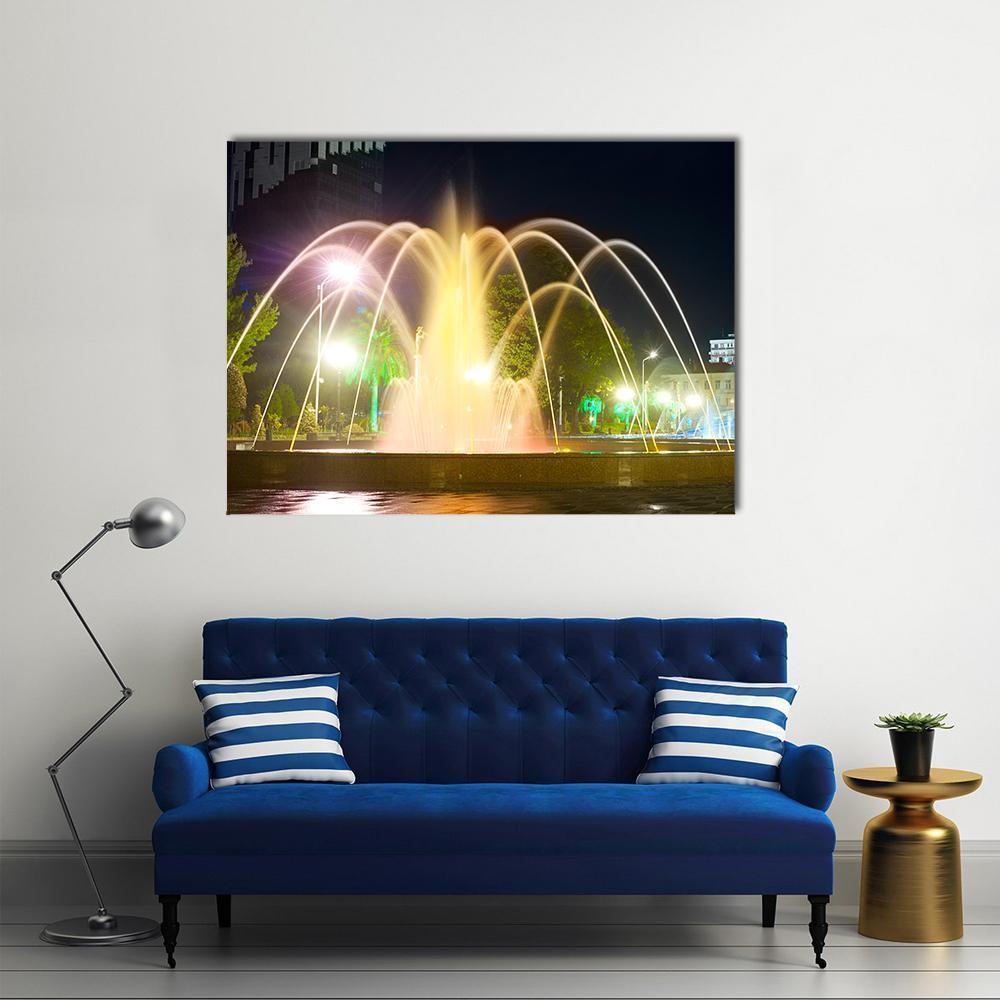 Colorful Musical Fountains Canvas Wall Art in black, yellow and multicolor, single panel hung on a wall