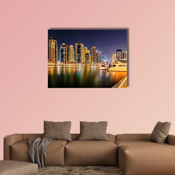 Dubai Night Skyline Harbor Reflections Canvas Wall Art in black, gold and blue, single panel hung on a wall