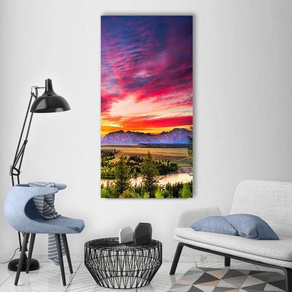 Colorful Sunset Over Snake River Vertical Canvas Wall Art in orange, purple and pink, single vertical panel hung on a wall