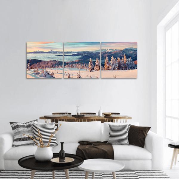 Snowy Carpathian Mountains at Sunset Panoramic Canvas Wall Art in white, blue and pink, hung on a wall