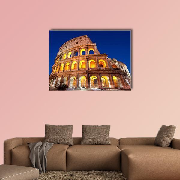 Colosseum at Dusk Canvas Wall Art in brown, yellow and blue, single panel hung on a wall