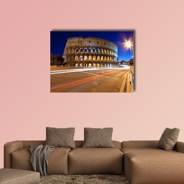 Colosseum at Night Canvas Wall Art in brown, yellow and blue, single panel hung on a wall