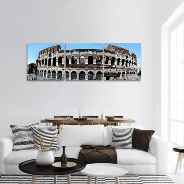 Roman Colosseum in Italy Panoramic Canvas Wall Art in gray, brown and blue, hung on a wall