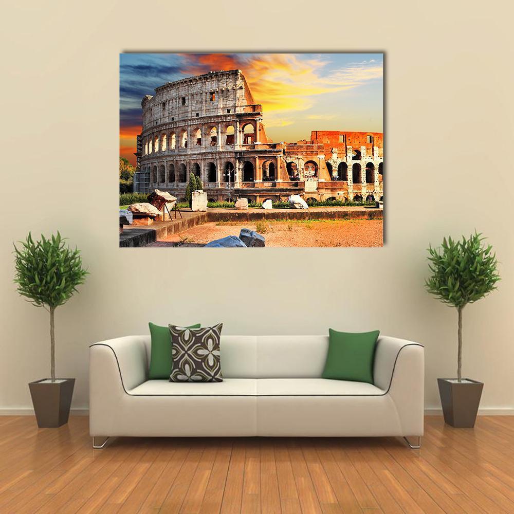 Sunset Over Colosseum in Rome Canvas Wall Art in orange, yellow and blue, single panel hung on a wall