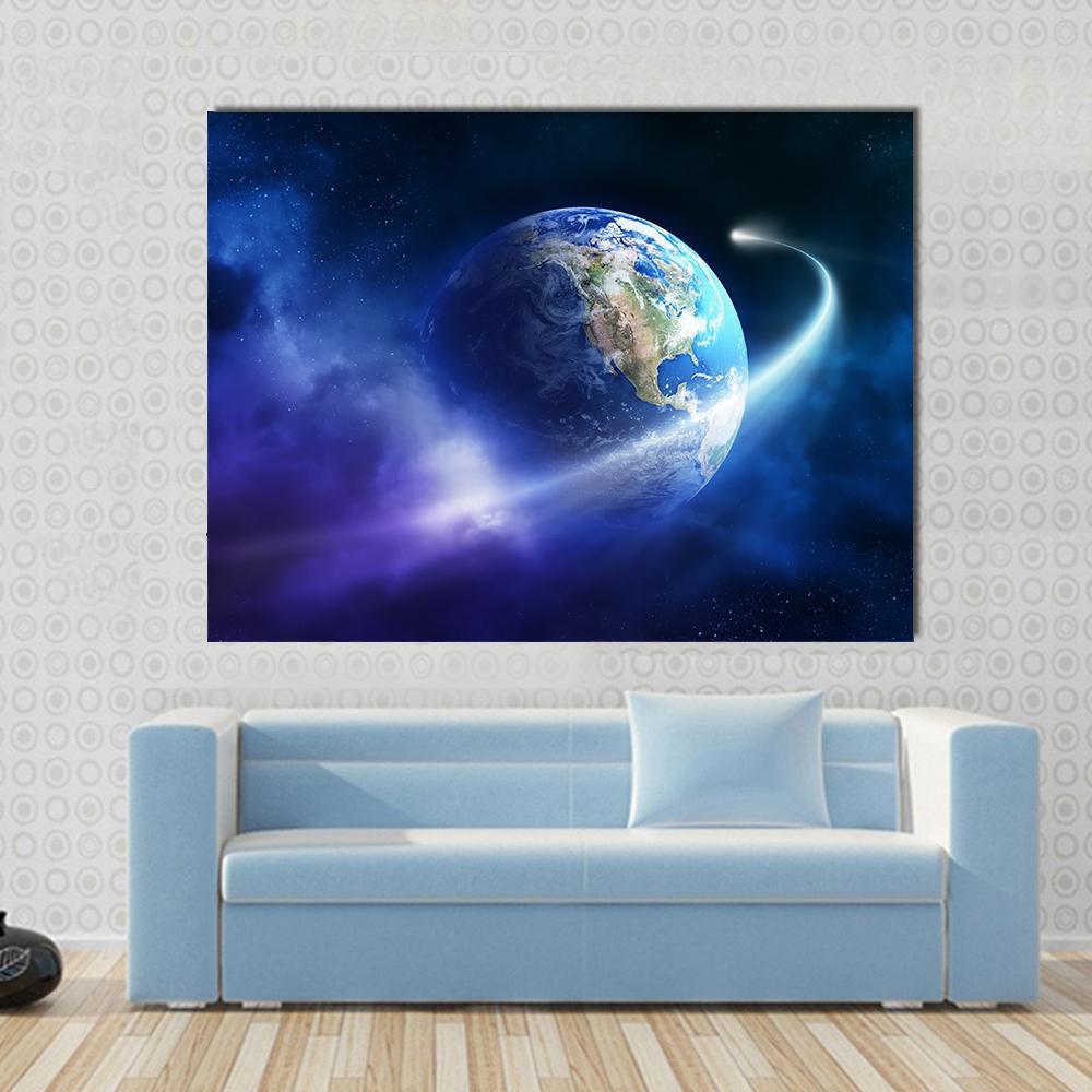 Comet Passing Earth Canvas Wall Art in black, blue and navy, single panel hung on a wall