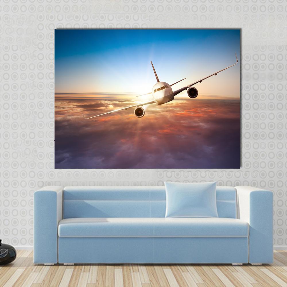 Commercial Airplane Canvas Wall Art in gray, orange and blue, single panel hung on a wall