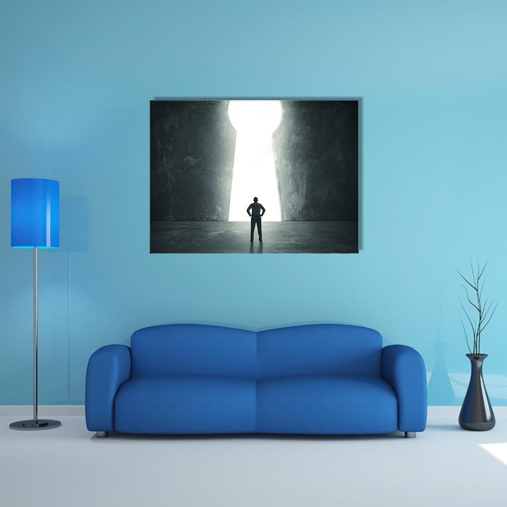 Silhouette Facing Glowing Keyhole Canvas Wall Art in black, white and gray, single panel hung on a wall