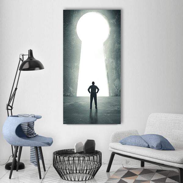 Concept of Success: Man at Keyhole Vertical Canvas Wall Art in black, white and gray, single vertical panel hung on a wall