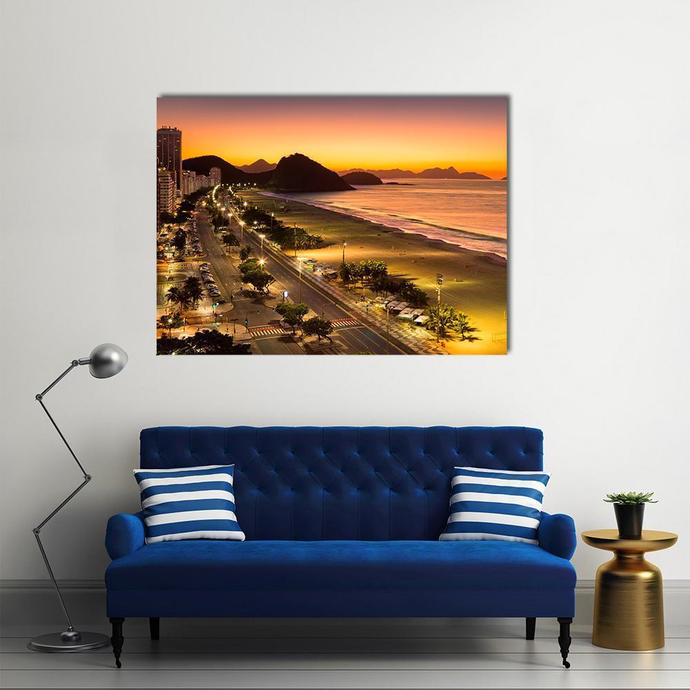 Copacabana Beach at Dawn Canvas Wall Art in black, orange and yellow, single panel hung on a wall