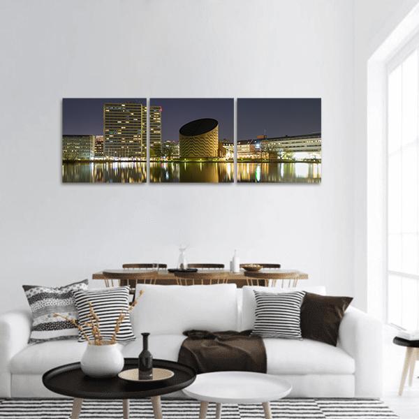 Copenhagen Planetarium Skyline Panoramic Canvas Wall Art in black, gray and yellow, hung on a wall