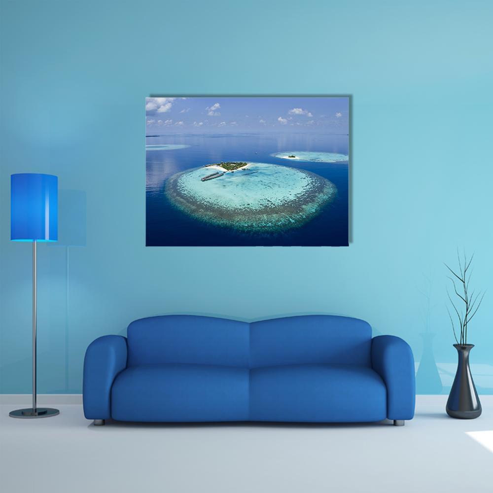 Maldives Coral Atoll Aerial View Canvas Wall Art in white and blue, single panel hung on a wall