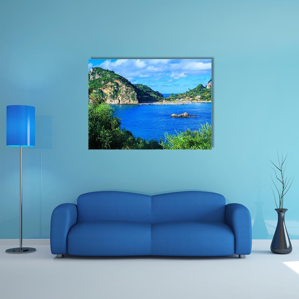 Corfu Bay with Rocky Islet and Lush Foreground Canvas Wall Art in white, green and blue, single panel hung on a wall