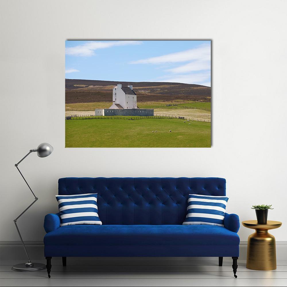Corgarth Castle with Grazing Sheep Canvas Wall Art in brown, green and blue, single panel hung on a wall