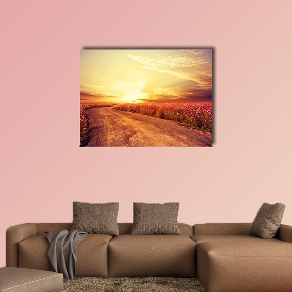Pink Cosmos Field at Sunrise Canvas Wall Art in orange, yellow and pink, single panel hung on a wall