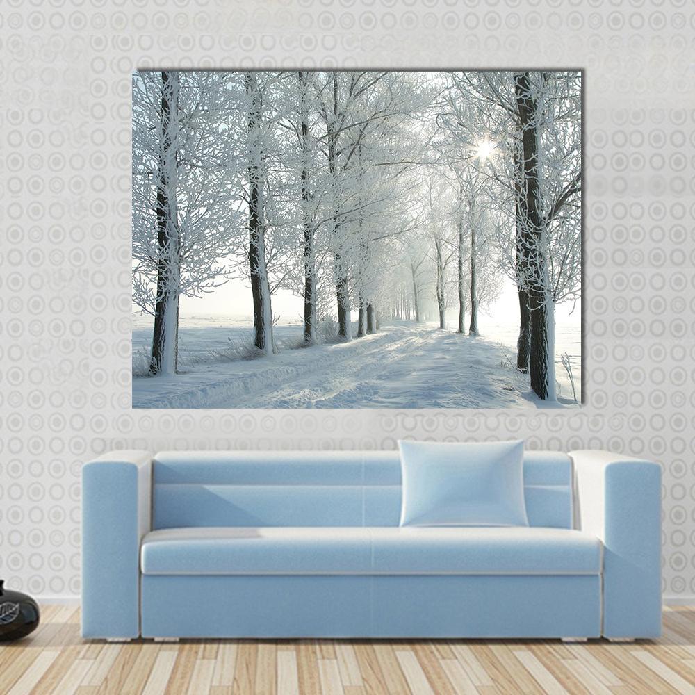Country Road in Winter Canvas Wall Art in white, gray and brown, single panel hung on a wall