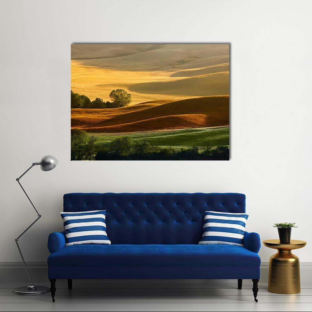 Golden Countryside Landscape with Rolling Hills Canvas Wall Art in brown, gold and yellow, single panel hung on a wall